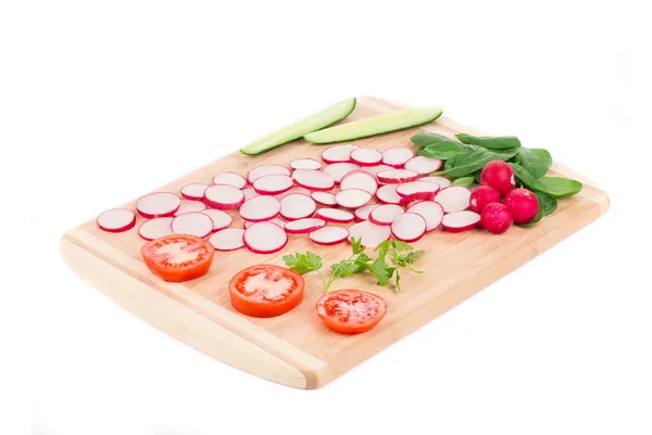 Fresh sliced vegetables on cutting board. — Stock Photo, Image