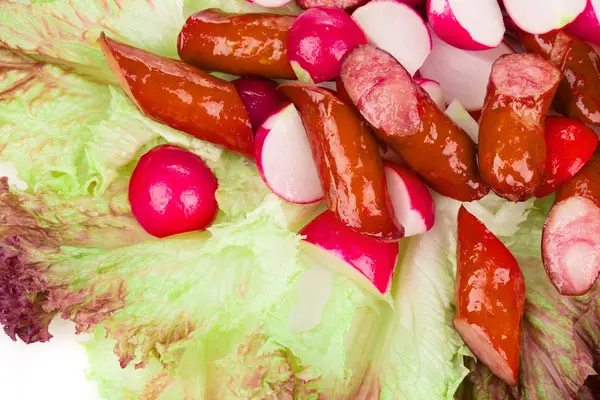 Close up of radish salad with sausage. — Stock Photo, Image