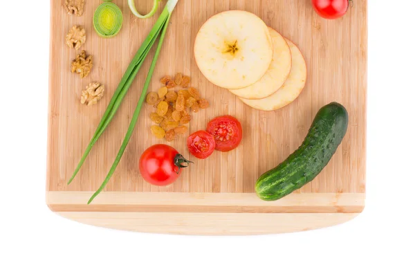 Vegetables on wooden platter. Close up. — Stock Photo, Image