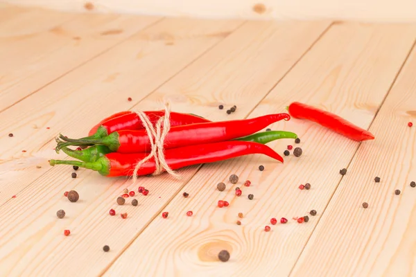 Hot chili pepper on wood — Stock Photo, Image