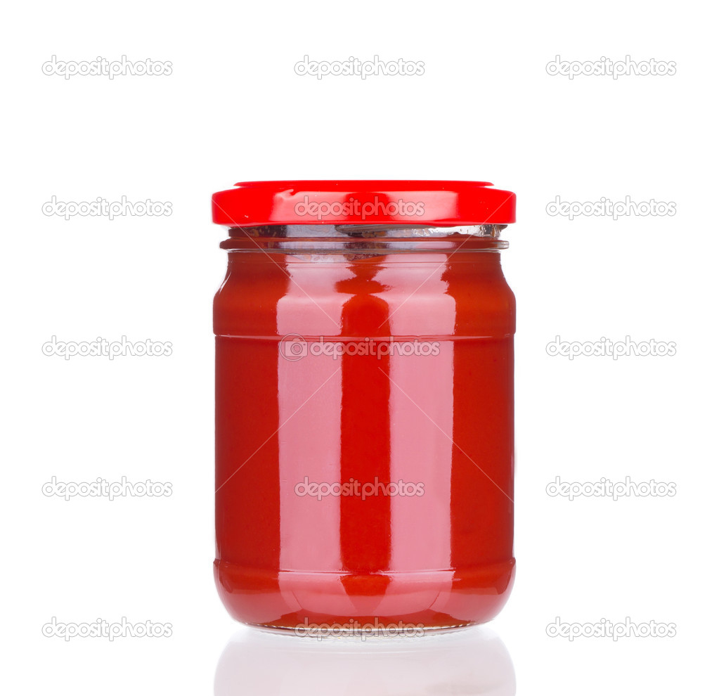 Glass jar with tomato sauce.