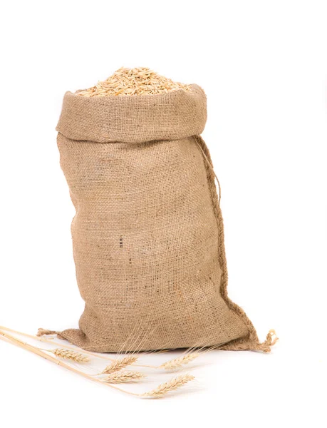 Saco de arpillera con avena — Foto de Stock