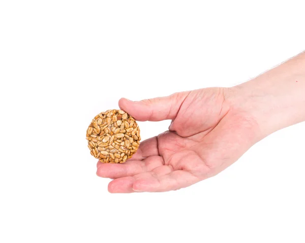 Candied seeds in hand. — Stock Photo, Image