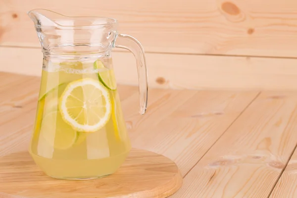 Glass pitcher full of fresh cold tasty lemonade. — Stock Photo, Image