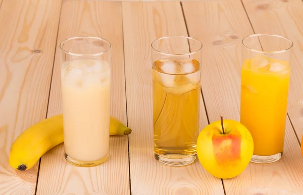 Tasty various juices on wood table. — Stock Photo, Image