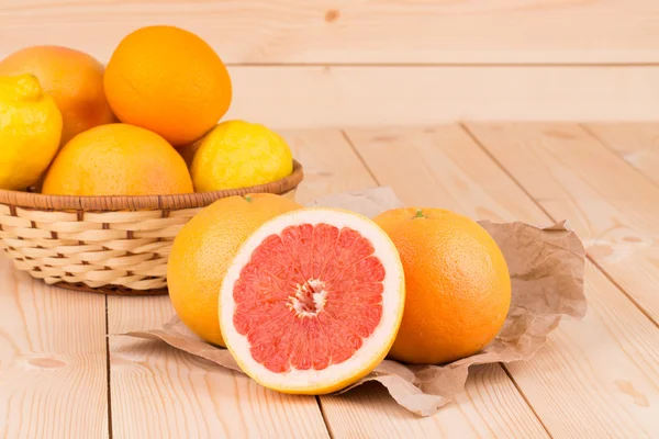 Grapefruit on a wooden background — Stock Photo, Image