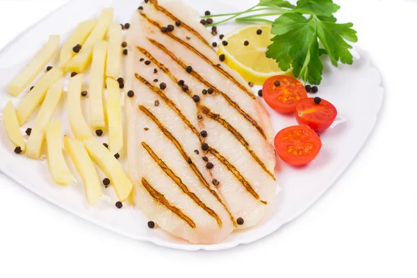 Grilled fish with fresh tomatoes and french fries — Stock Photo, Image