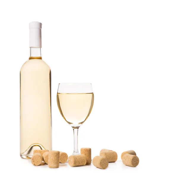 Glass of white wine with corks — Stock Photo, Image