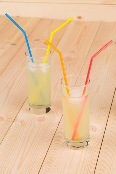 Lemonade on wooden background — Stock Photo, Image