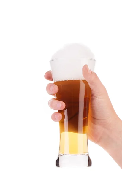 Male hand holding up a glass of beer — Stock Photo, Image