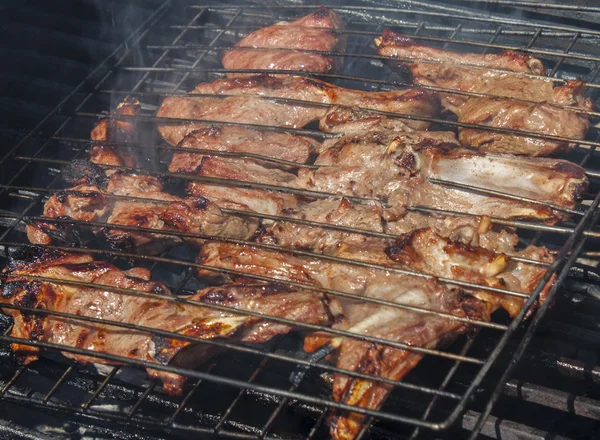 Grilled meat in special fixture. — Stock Photo, Image