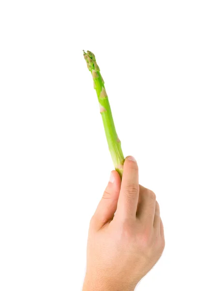 Mão segurando espargos verdes . — Fotografia de Stock