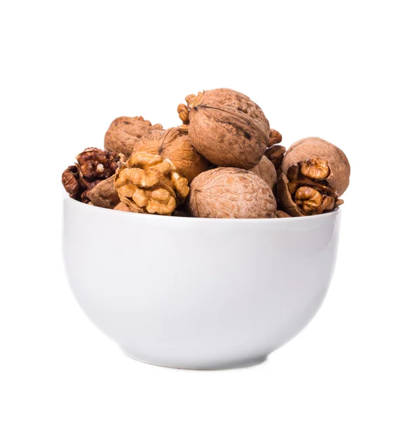 Close up of walnuts bunch in bowl. — Stock Photo, Image