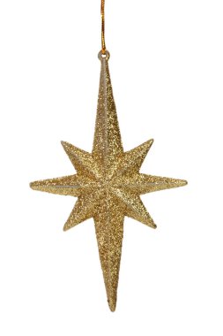 Altın yıldız şeklinde bir Noel ağacı oyuncağı. Beyaz bir arka planda izole edilmiştir. Yakın plan..