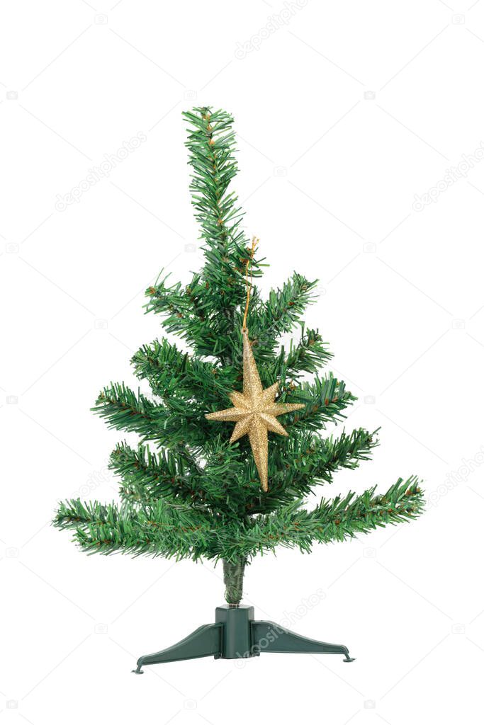 Artificial Christmas tree with golden star. Isolated over white background. Close-up.