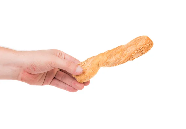 Brot mit Sesam in der Hand — Stockfoto