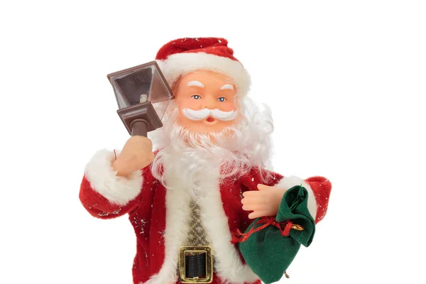 一个有手提包和手电筒的玩具圣诞老人被白色的背景隔离了四 后续行动 — 图库照片