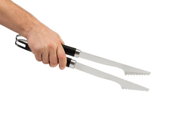 Eine Hand Hält Eine Küchenzange Vereinzelt Auf Weißem Hintergrund Nahaufnahme — Stockfoto