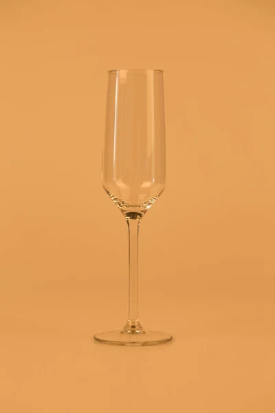 One Elegant Empty Champagne Glass Located Orange Background Close — Fotografia de Stock