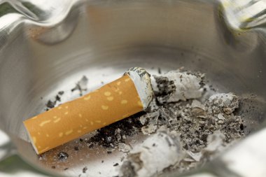 Cigarette butt in an ashtray