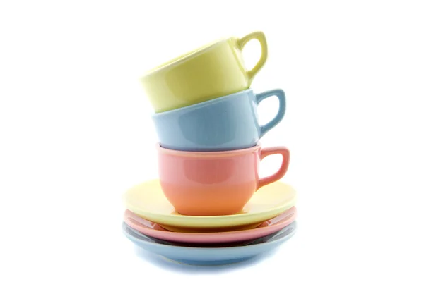 Tazas de té apiladas en amarillo, azul y rosa —  Fotos de Stock