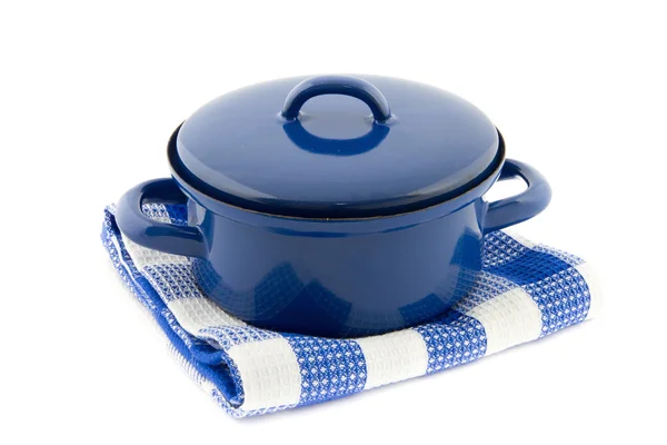 Blauw koken pan op een blauw geblokte theedoek — Stockfoto