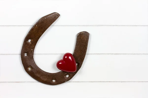 Horse shoe with heart symbol — Stock Photo, Image