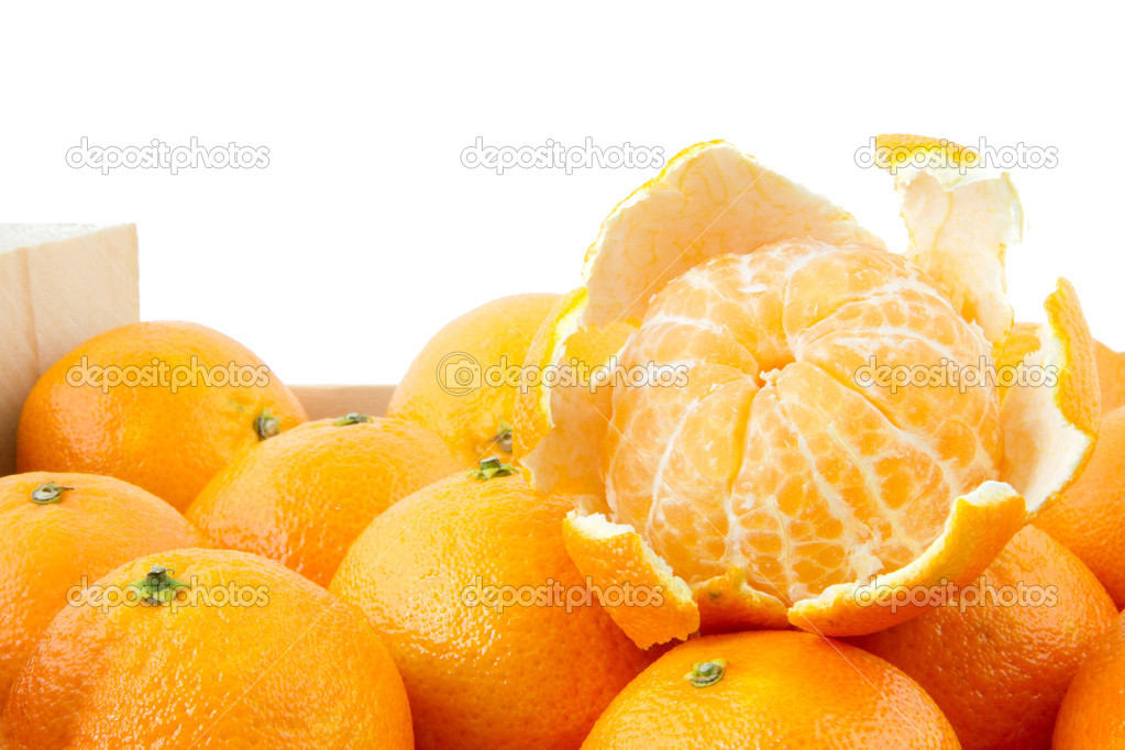 peeled mandarin on top of crate