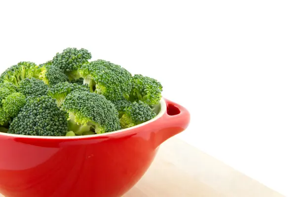 Broccoli in a red bowl — Stock Photo, Image