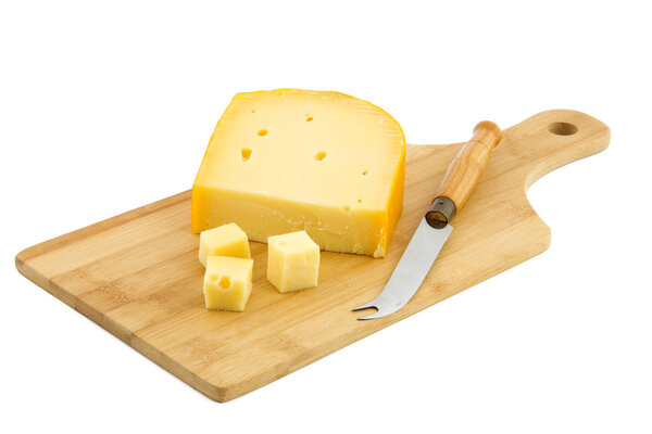 cutting board and piece of Dutch cheese