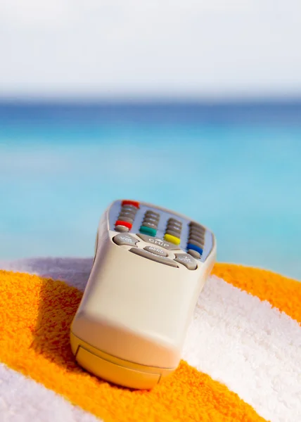 Remote Control with a sea background — Stock Photo, Image