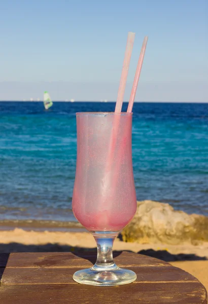 Empty dirty glassful and cocktail straw — Stock Photo, Image