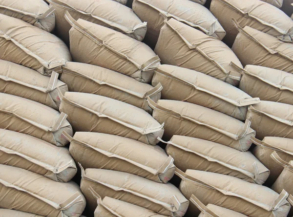 Pile sacks in warehouse — Stock Photo, Image