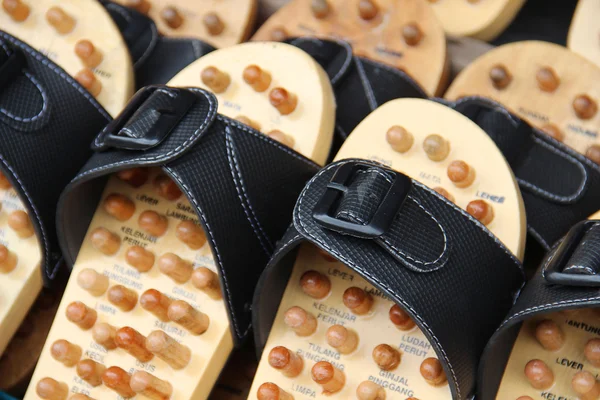 Wooden massage slippers at the market — Stock Photo, Image