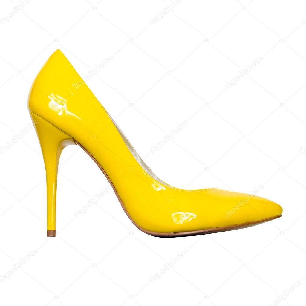 Yellow patent leather shoes isolated on white background