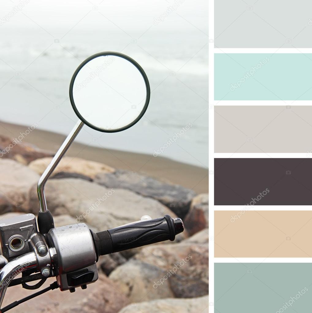 Motorcycle on sea background with space for text, colour palette swatches.