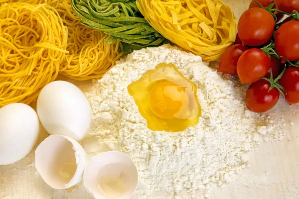 Ingredients for preparation of homemade egg pasta — Stock Photo, Image