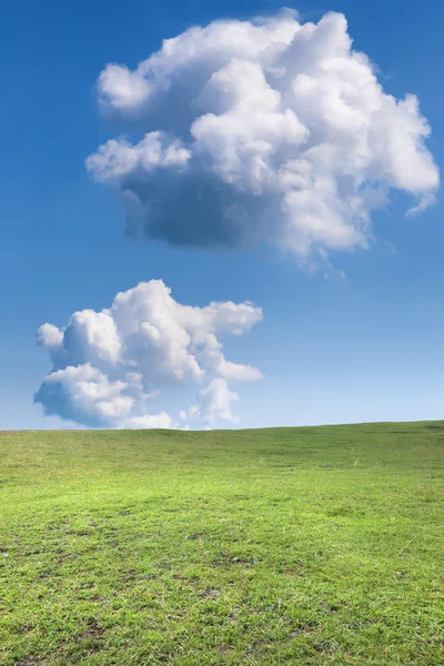 Two clouds over mountain meadow — Stock Photo, Image