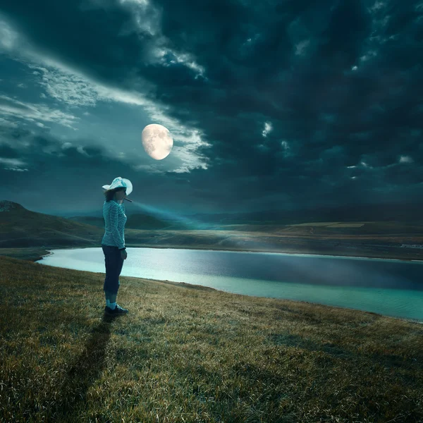 Night walk in the moonlight with a flashlight — Stock Photo, Image