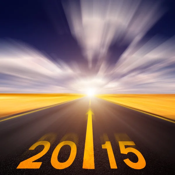 Motion blurred empty asphalt road forward to new year — Stock Photo, Image