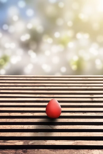 Wooden floor and easter egg with idyllic bokeh — Stock Photo, Image