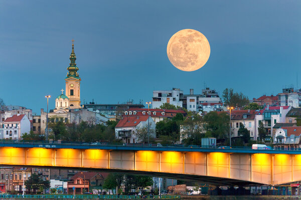 Cityscape of Belgrade in night of full moon