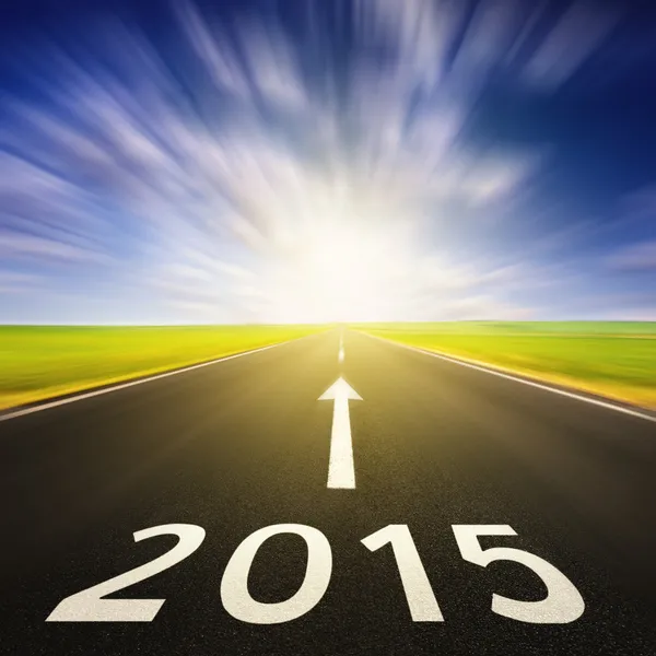 Driving on an empty road in speed to 2015 — Stock Photo, Image