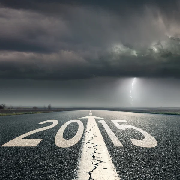 Driving on road towards the storm to 2015 — Stock Photo, Image