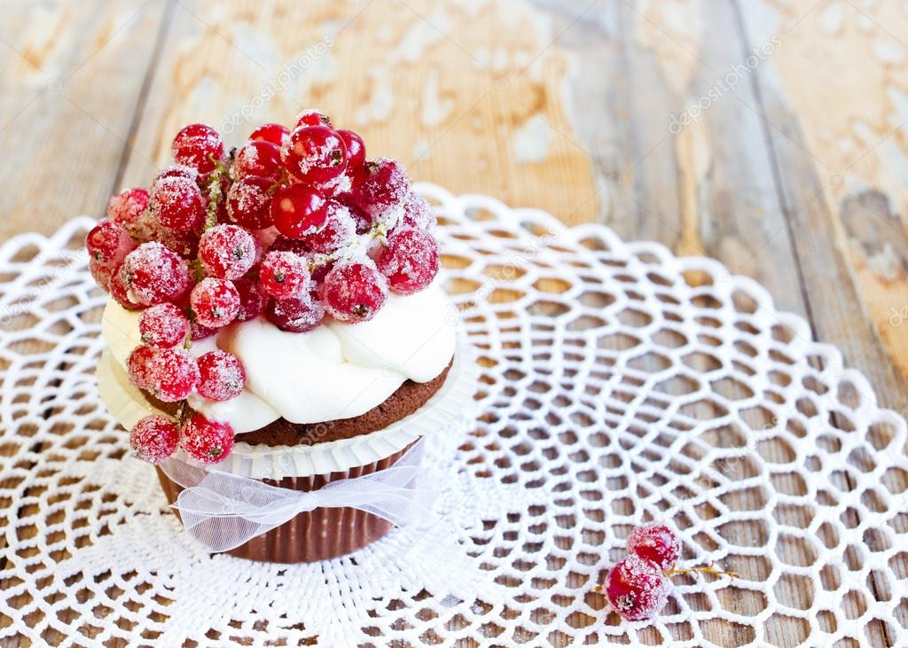 Sugared redcurrants on chocolate cupcake.
