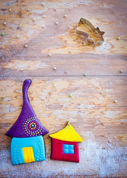 Sweet village. Colorful cookies on wooden background — Stock Photo, Image