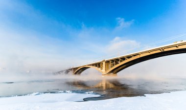 Bridge over Yenisei River, Krasnoyarsk, Russia. Selective focus. clipart