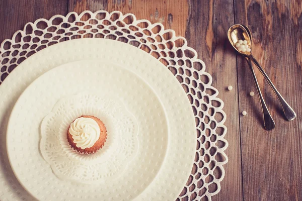 Beautiful tableware with little cupcakes