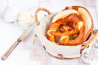 Tasty german pretzels in basket clipart