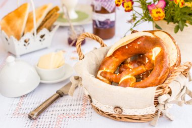 Tasty german pretzels in basket clipart